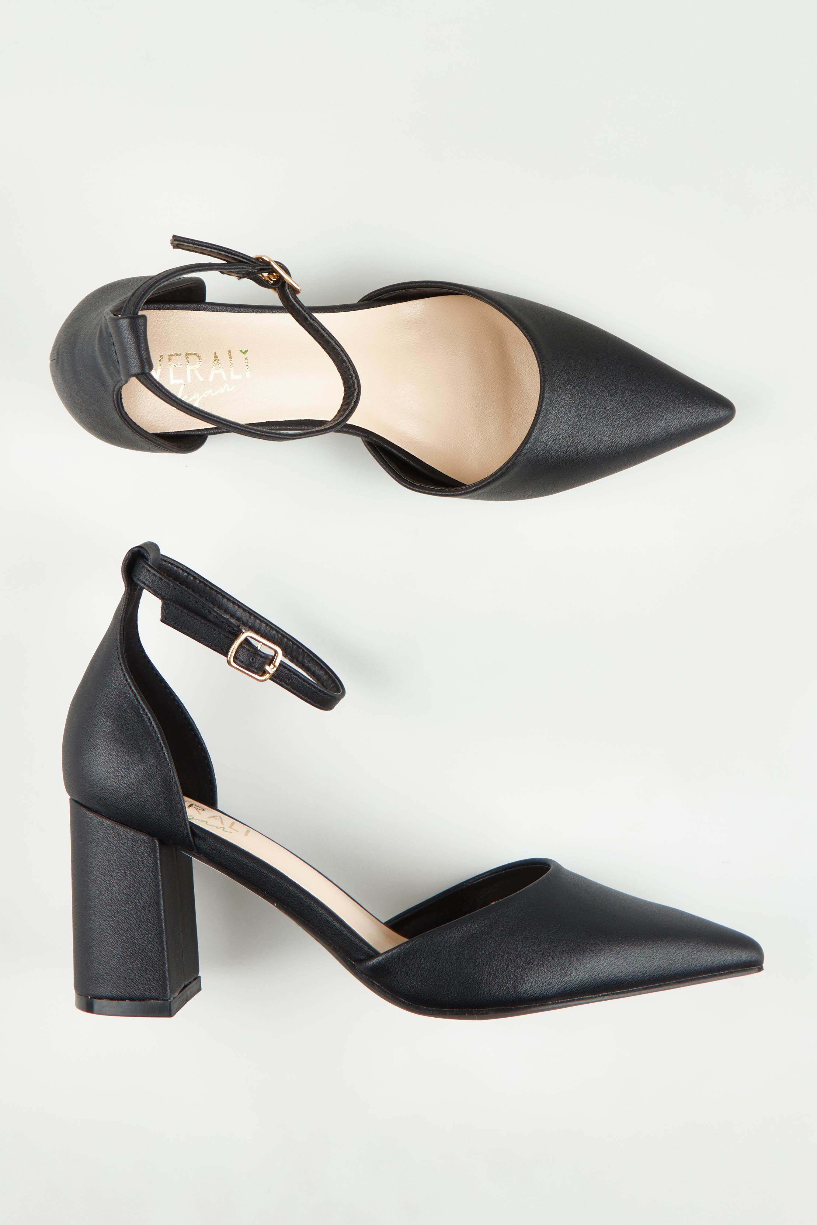A model wearing size 37 of the Eli Closed Toe Block Heel in colour Black (Black), from the front, showing the whole outfit
