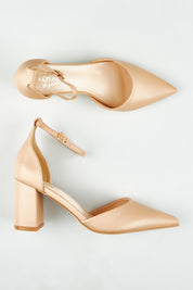 A model wearing size 37 of the Eli Closed Toe Block Heel in colour Nude, from the front, showing the whole outfit