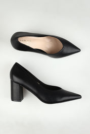 A model wearing size 37 of the Elliot Block Heel in colour Black (Black), from the front, showing the whole outfit