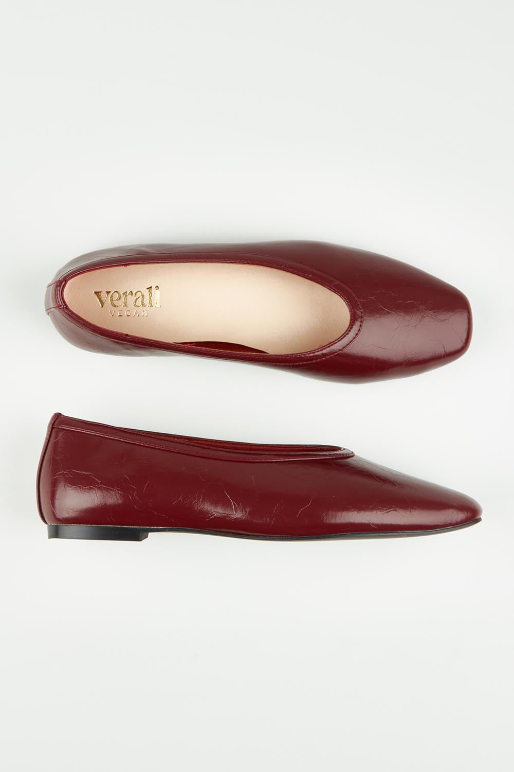 A model wearing size 37 of the Euphoria Ballet Flat in colour Winecrinkl (Red), from the front, showing the whole outfit