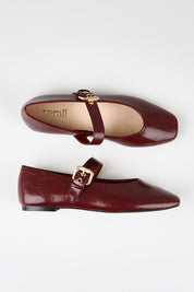 Model Genericm wearing size sample of the Europe Mary Jane Flat - Berryredcrinkle in colour Berryredcrinkle, from an angle
