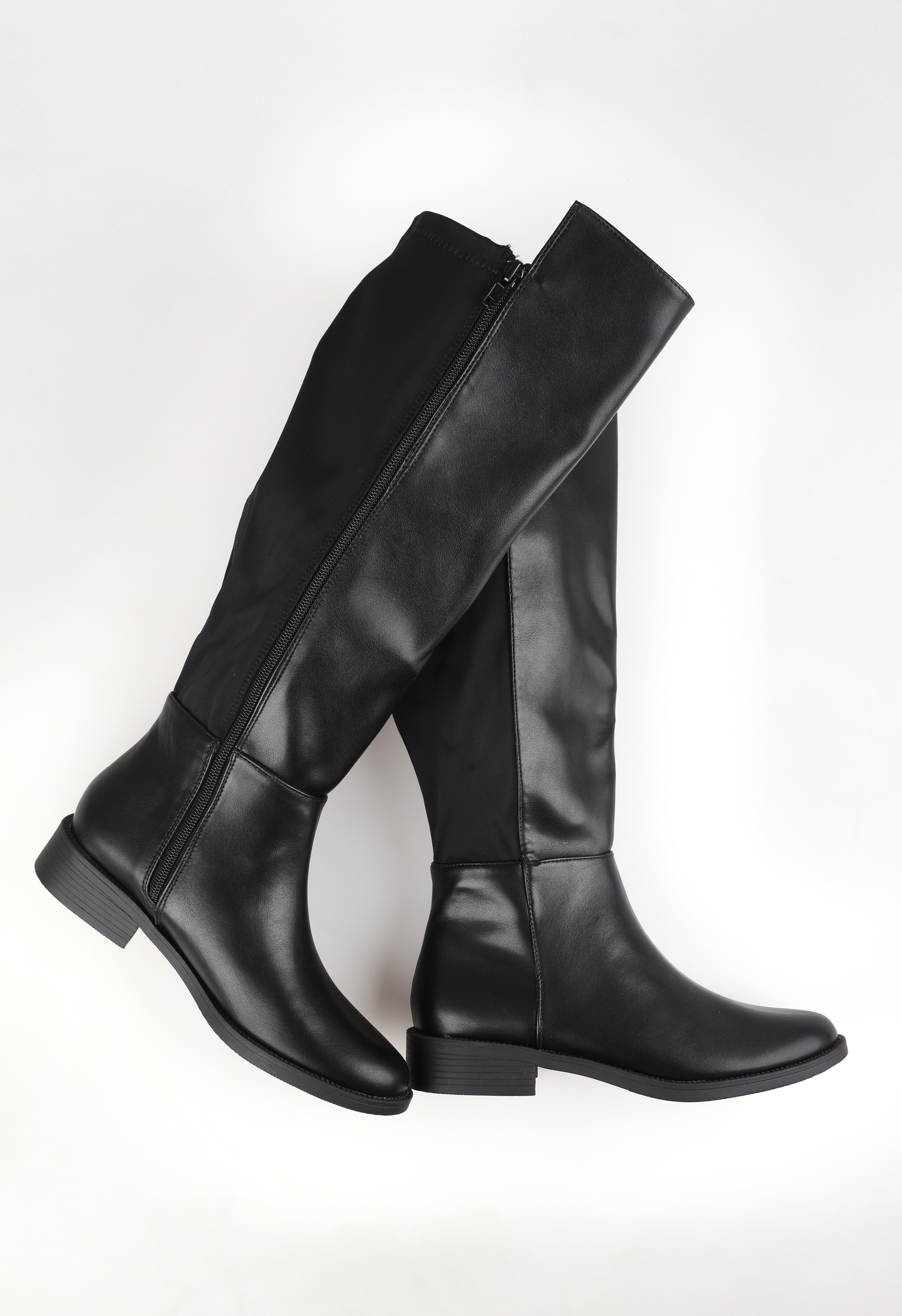 A model wearing size 37 of the Gala Knee Boot in colour Black (Black), from the front, showing the whole outfit