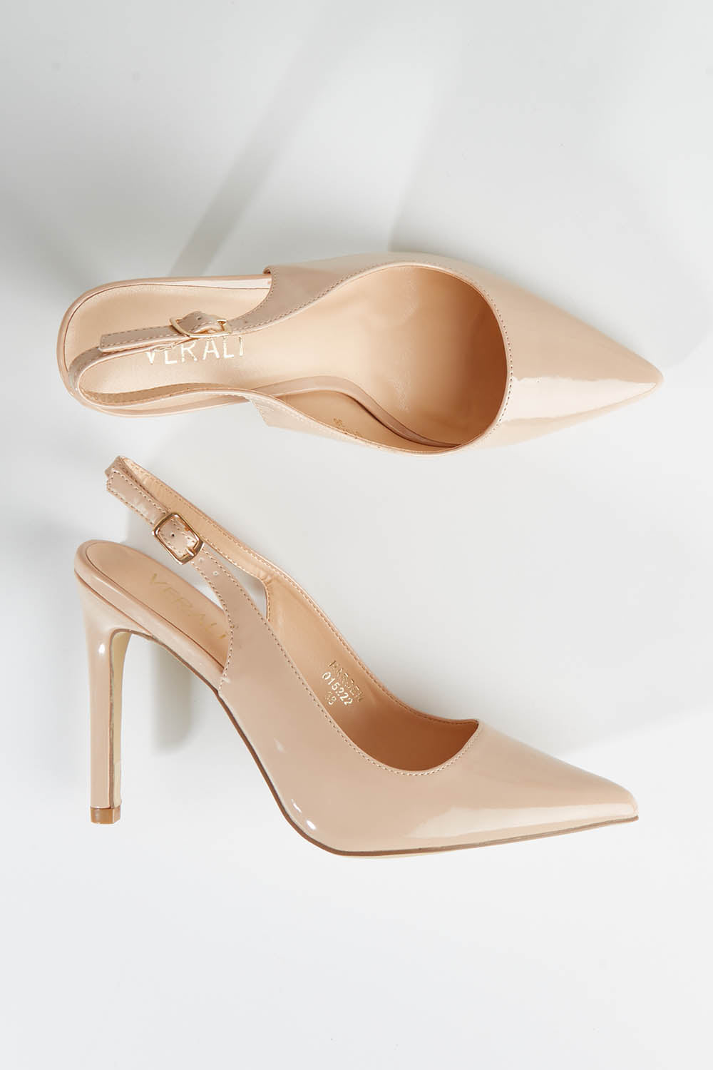 A model wearing size 36 of the Harden Stiletto Pumps in colour Nudepatent, from the front, showing the whole outfit