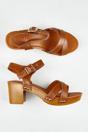 A model wearing size 37 of the Lulu Clog Heel in colour Tan, from the front, showing the whole outfit