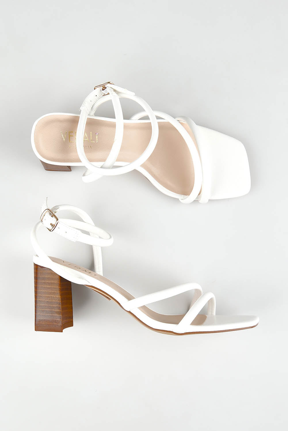 A model wearing size 37 of the Nadia Heel in colour White (White), from the front, showing the whole outfit