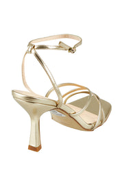 Product shot of the Penelope Heel in colour Champagne (Metallics), from the back
