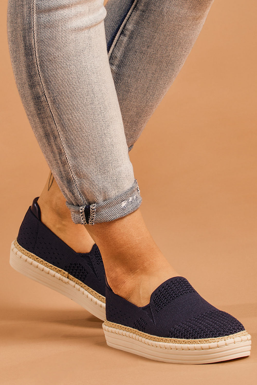 A model wearing size 38 of the Queen Stretch Flat in colour Navy (Blue), from the front, cropped image