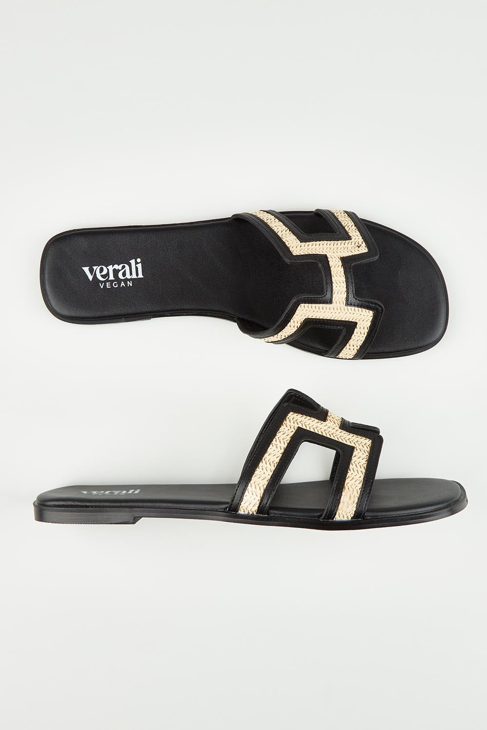 A model wearing size 37 of the Sandra Slide in colour Blackraffi (Black), from the front, showing the whole outfit