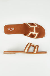 A model wearing size 37 of the Sandra Slide in colour Tanraffia, from the front, showing the whole outfit