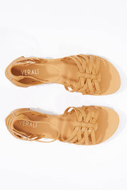 A model wearing size 36 of the San Marco Flat Sandal in colour Tan, from the front, showing the whole outfit