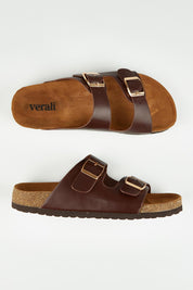 A model wearing size 37 of the Xylo Slide in colour Chocolate, from the front, showing the whole outfit