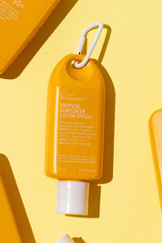A model wearing the Tropical Sunscreen Lotion Spf50+ 75Ml in colour Tropical, from the front, showing the whole outfit