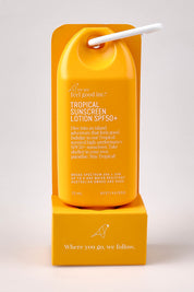 A model wearing the Tropical Sunscreen Lotion Spf50+ 75Ml in colour Tropical, from the front, showing the whole outfit
