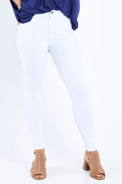 Model Larissa wearing size 10 of the Charlee High Rise Skinny Jean in colour White (White), from the front, cropped image