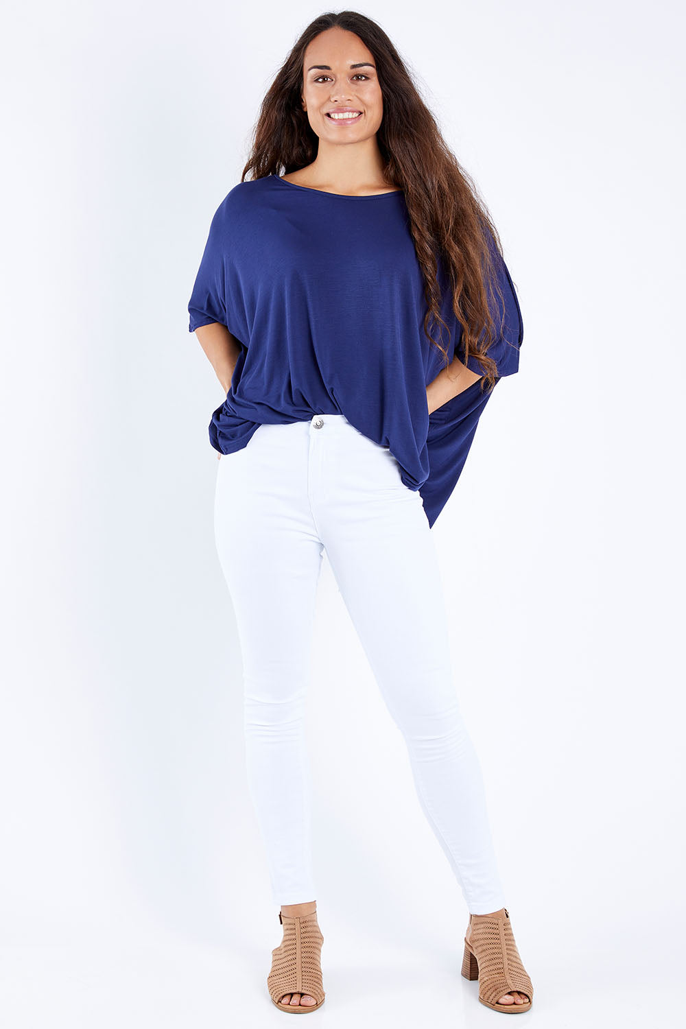Model Larissa wearing size 10 of the Charlee High Rise Skinny Jean in colour White (White), from the front, showing the whole outfit
