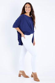 Model Larissa wearing size 10 of the Charlee High Rise Skinny Jean in colour White (White), from the front, showing the whole outfit