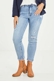 Model Tahlia wearing size 10 of the Vicky Distressed High Rise Jean in colour Blue (Blue), from the front, cropped image