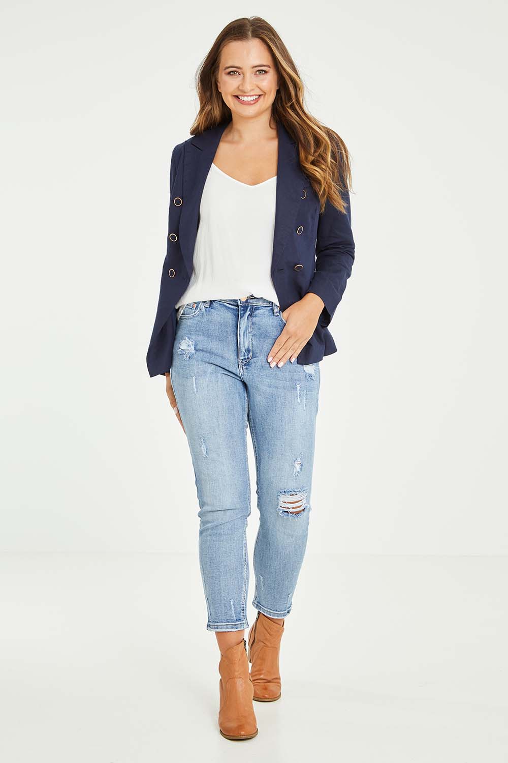 Model Tahlia wearing size 10 of the Vicky Distressed High Rise Jean in colour Blue (Blue), from the front, showing the whole outfit