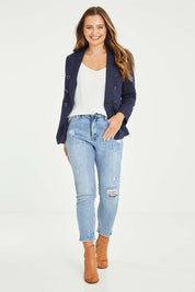 Model Tahlia wearing size 10 of the Vicky Distressed High Rise Jean in colour Blue (Blue), from the front, showing the whole outfit