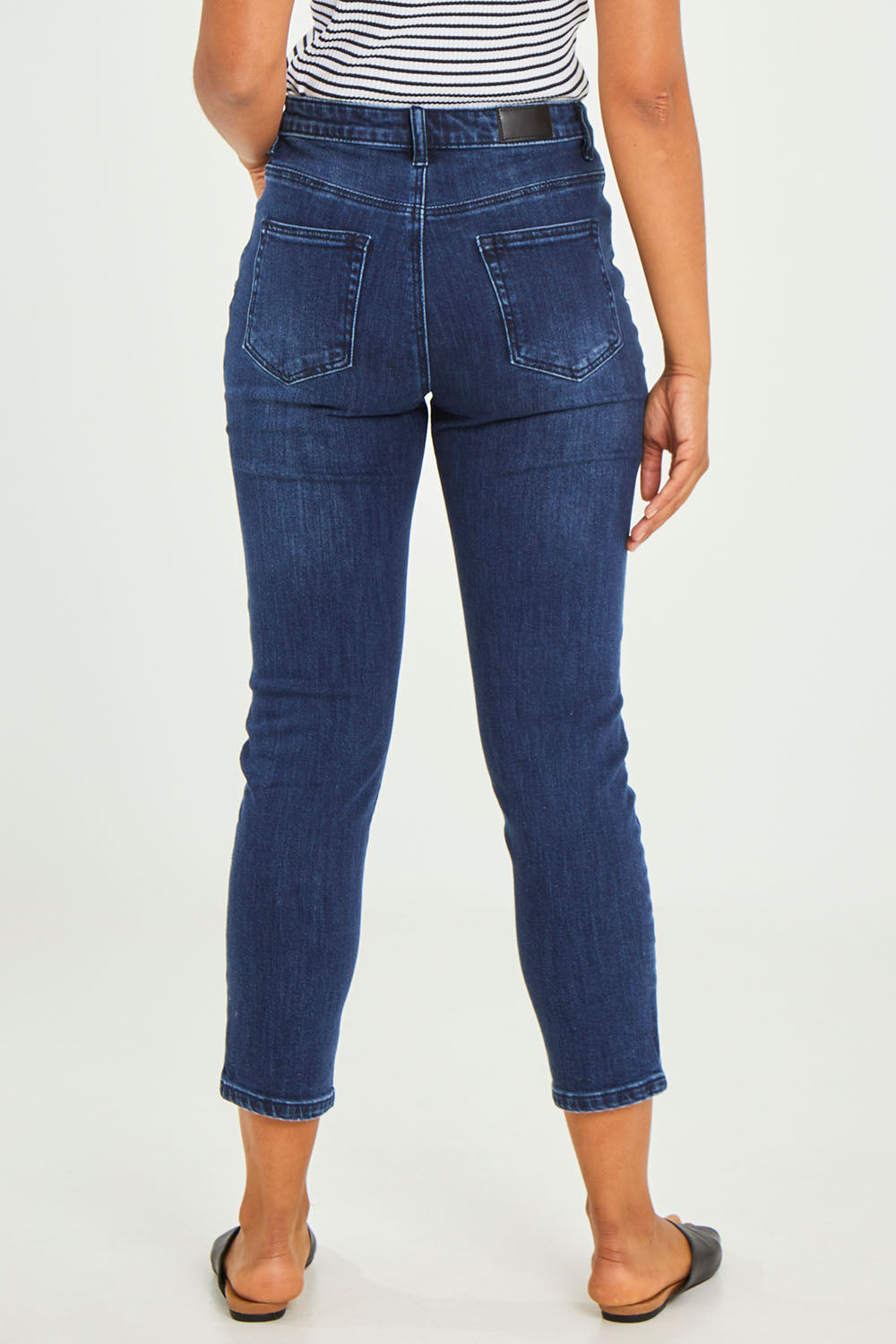 Model Olivia wearing size 10 of the Samantha High Rise Jean in colour Darkblue (Blue), from the back