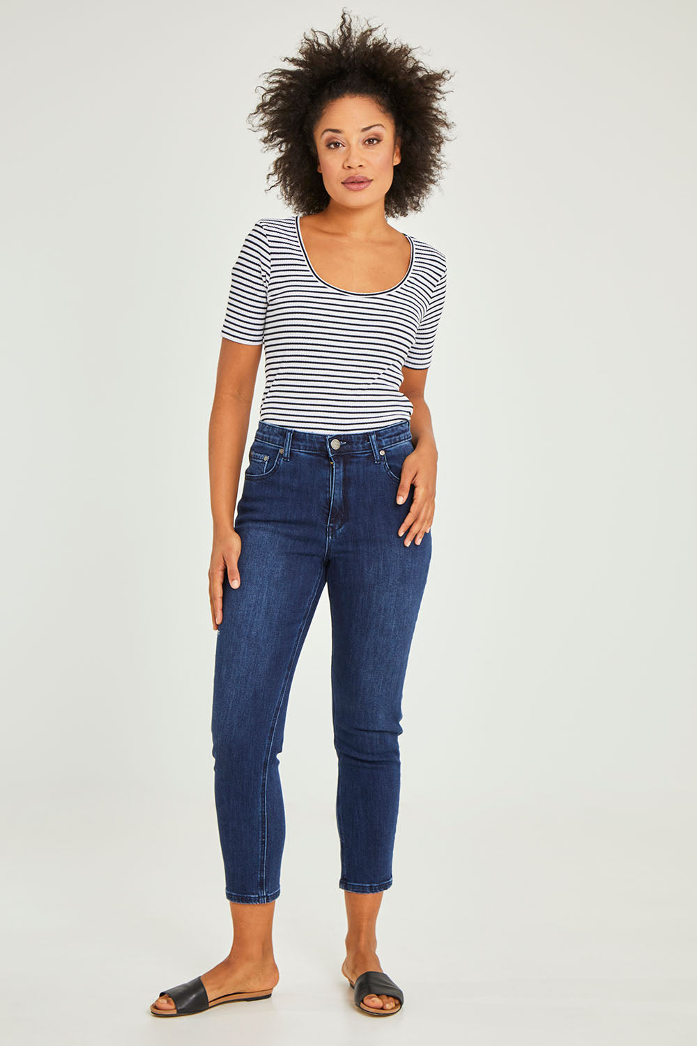 Model Olivia wearing size 10 of the Samantha High Rise Jean in colour Darkblue (Blue), from the front, showing the whole outfit