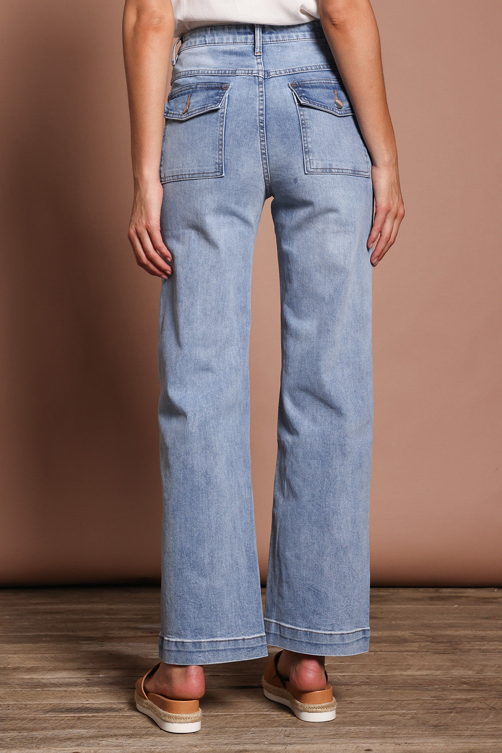 Model Madeline wearing size 9 of the Lou Highin colourWaisted Wide Leg Jean - Lightdenim (Blue), from the back