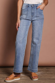 Model Madeline wearing size 9 of the Lou Highin colourWaisted Wide Leg Jean - Lightdenim (Blue), from the front, cropped image