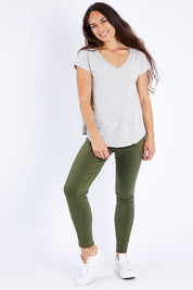 Model Larissa wearing size 10 of the Sutton High Rise Skinny Jean in colour Khaki (Green), from the front, showing the whole outfit