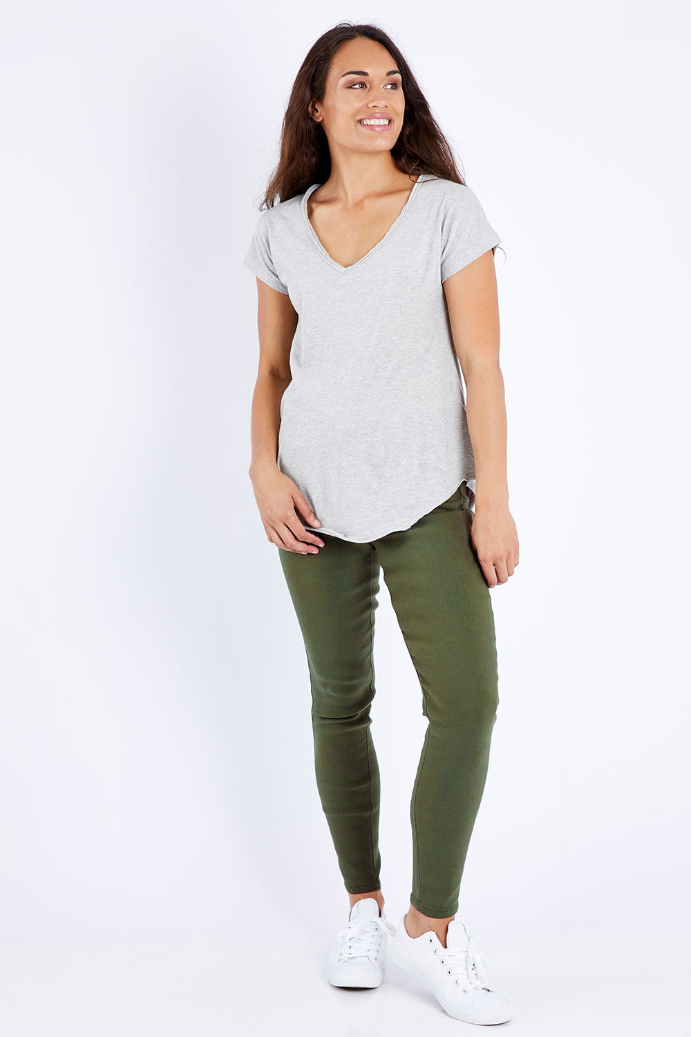Model Larissa wearing size 10 of the Sutton High Rise Skinny Jean in colour Khaki (Green), from the front, showing the whole outfit