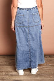 Model Sandy wearing size 10 of the Millie Pull On Denim Skirt in colour Denim (Blue), from the back