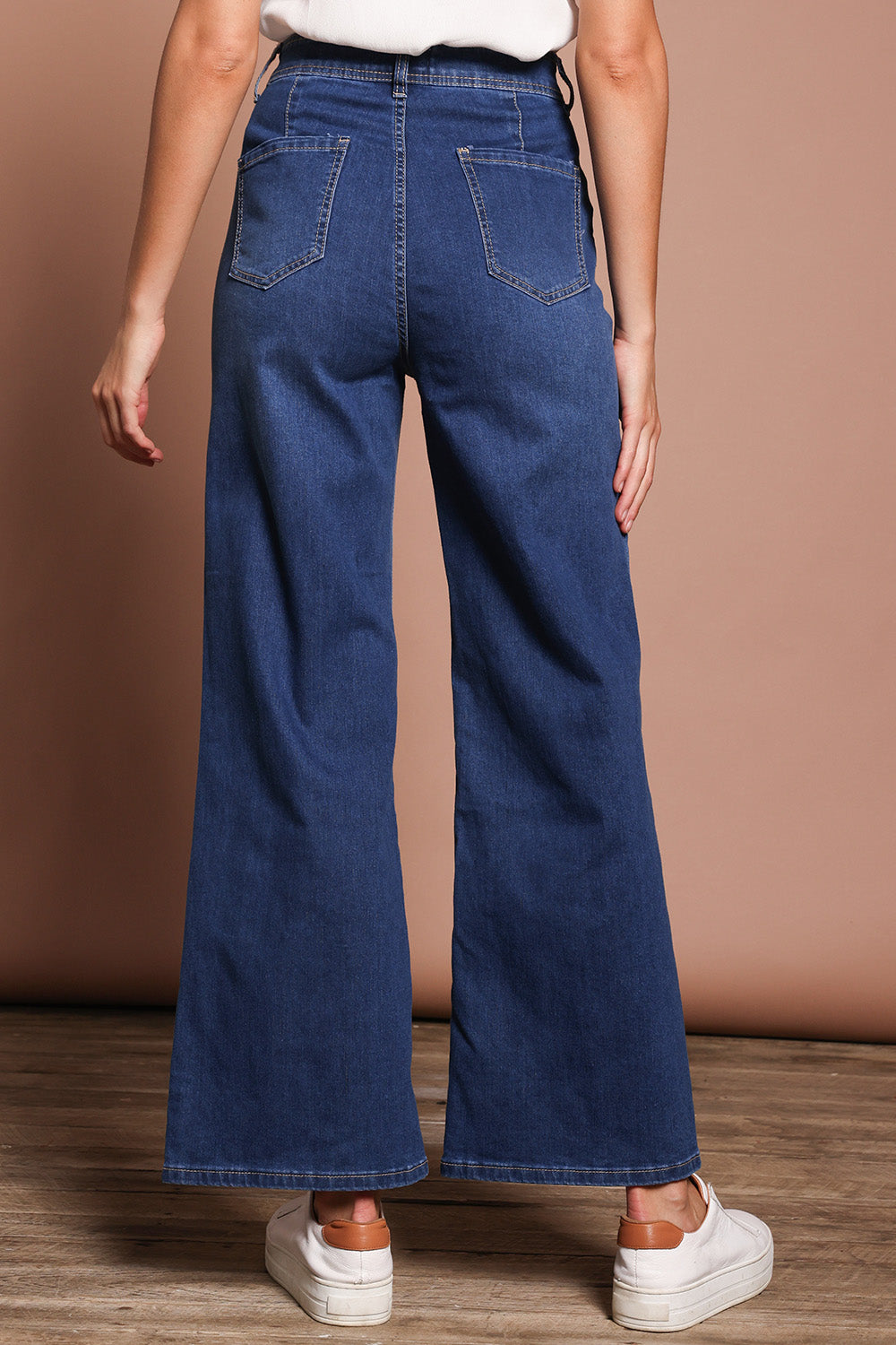 Model Madeline wearing size 9 of the Candice Wide Leg Jean in colour Darkblue (Blue), from the back