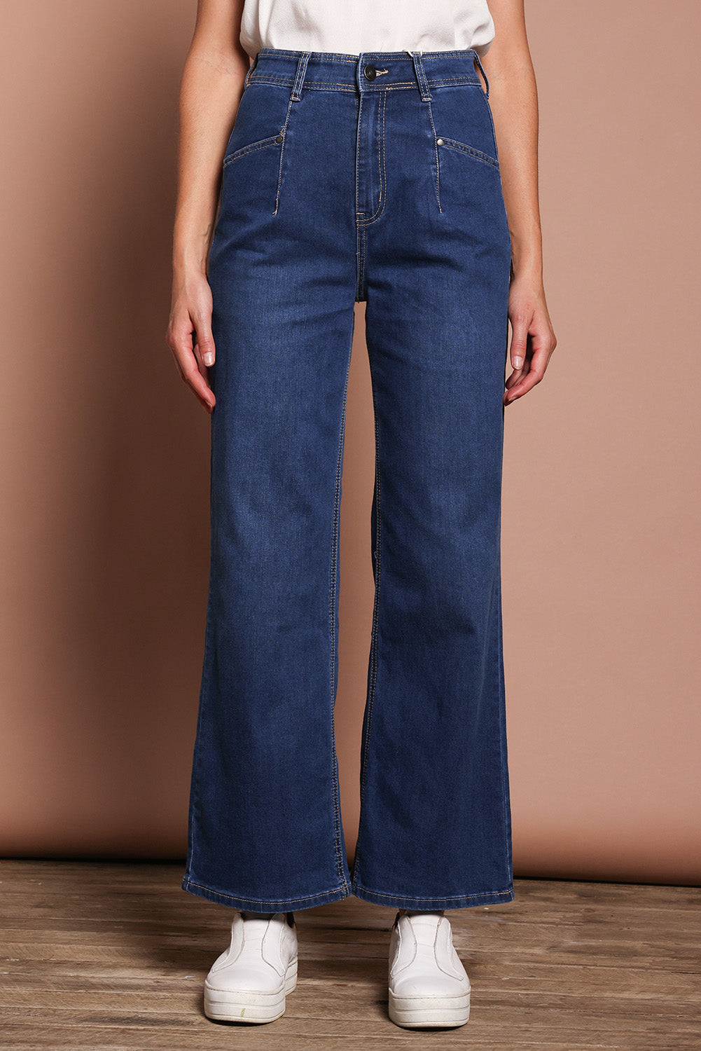 Model Madeline wearing size 9 of the Candice Wide Leg Jean in colour Darkblue (Blue), from the front, cropped image