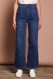 Model Madeline wearing size 9 of the Candice Wide Leg Jean in colour Darkblue (Blue), from the front, cropped image