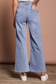 Model Madeline wearing size 9 of the Candice Wide Leg Jean in colour Lightblue (Blue), from the back