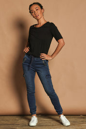 Model Katie wearing size 10 of the Harlow Cargo Jogger in colour Darkdenim (Blue), from the front, showing the whole outfit