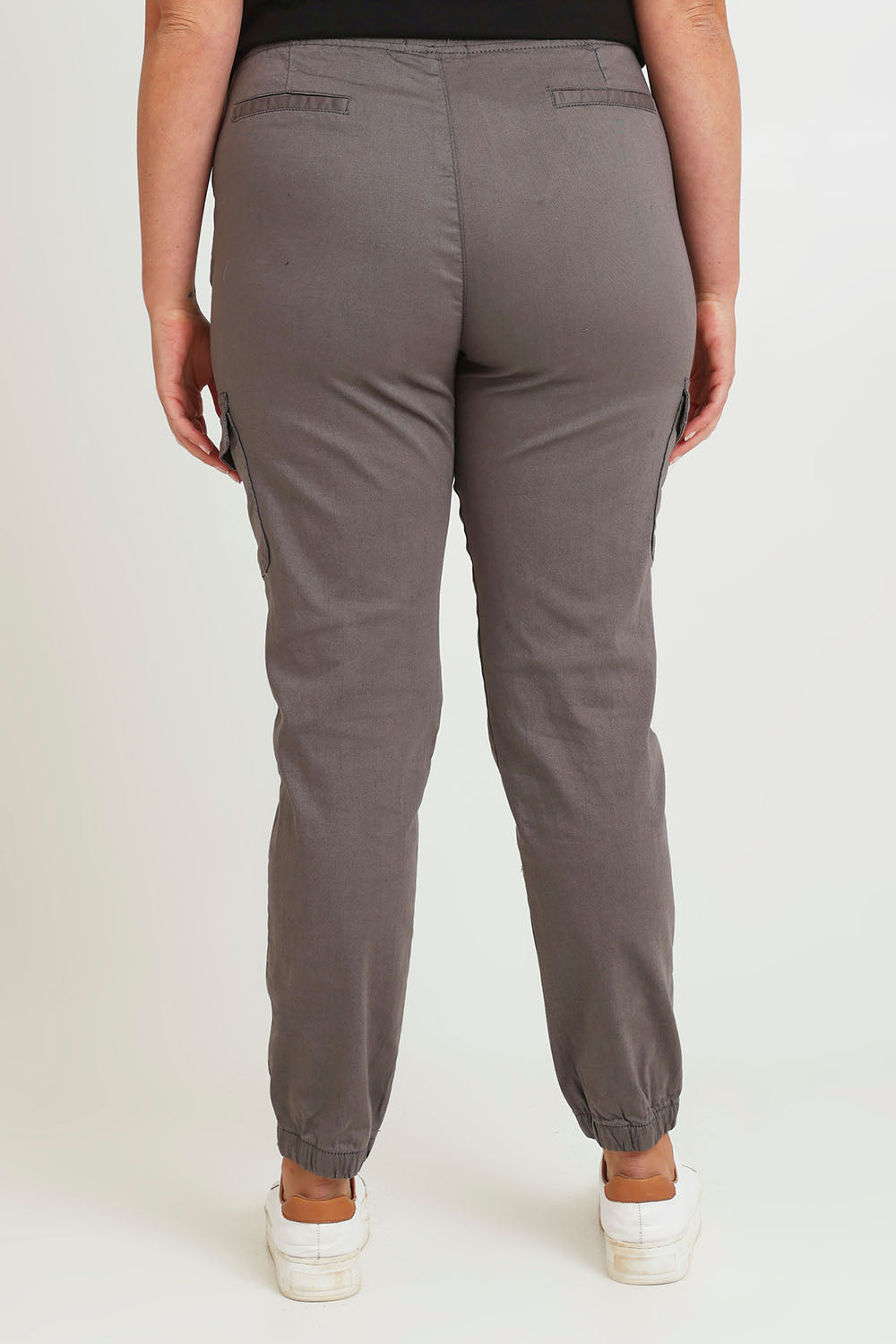 Model Chanel wearing size 16 of the Harlow Cargo Jogger in colour Grey (Grey), from the back