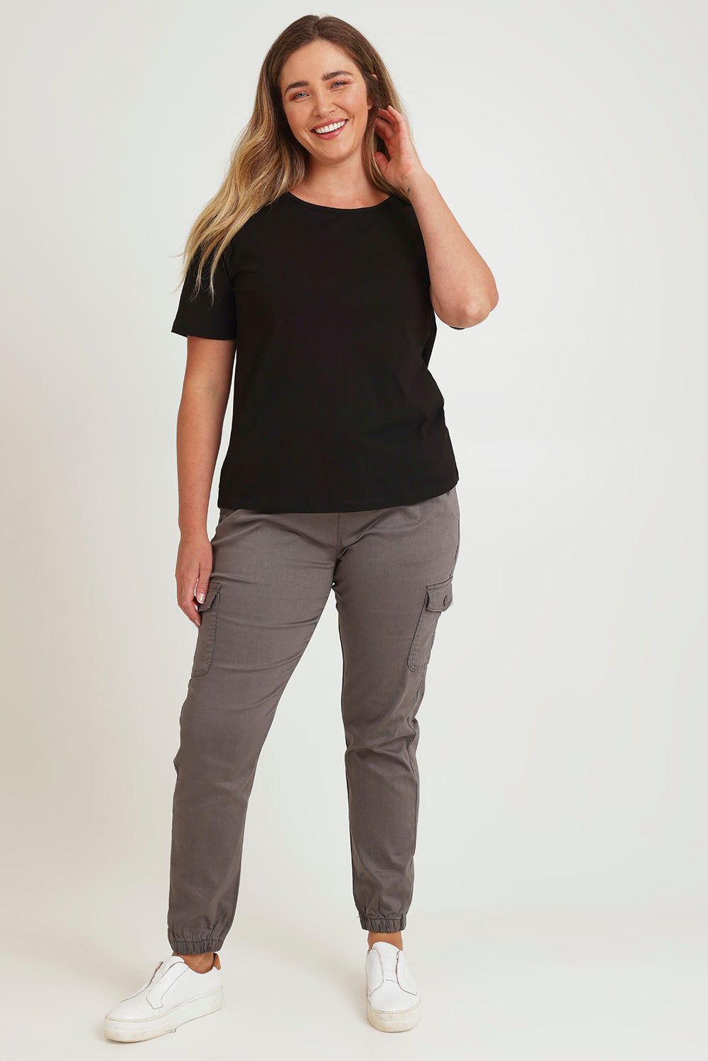 Model Chanel wearing size 16 of the Harlow Cargo Jogger in colour Grey (Grey), from the front, showing the whole outfit