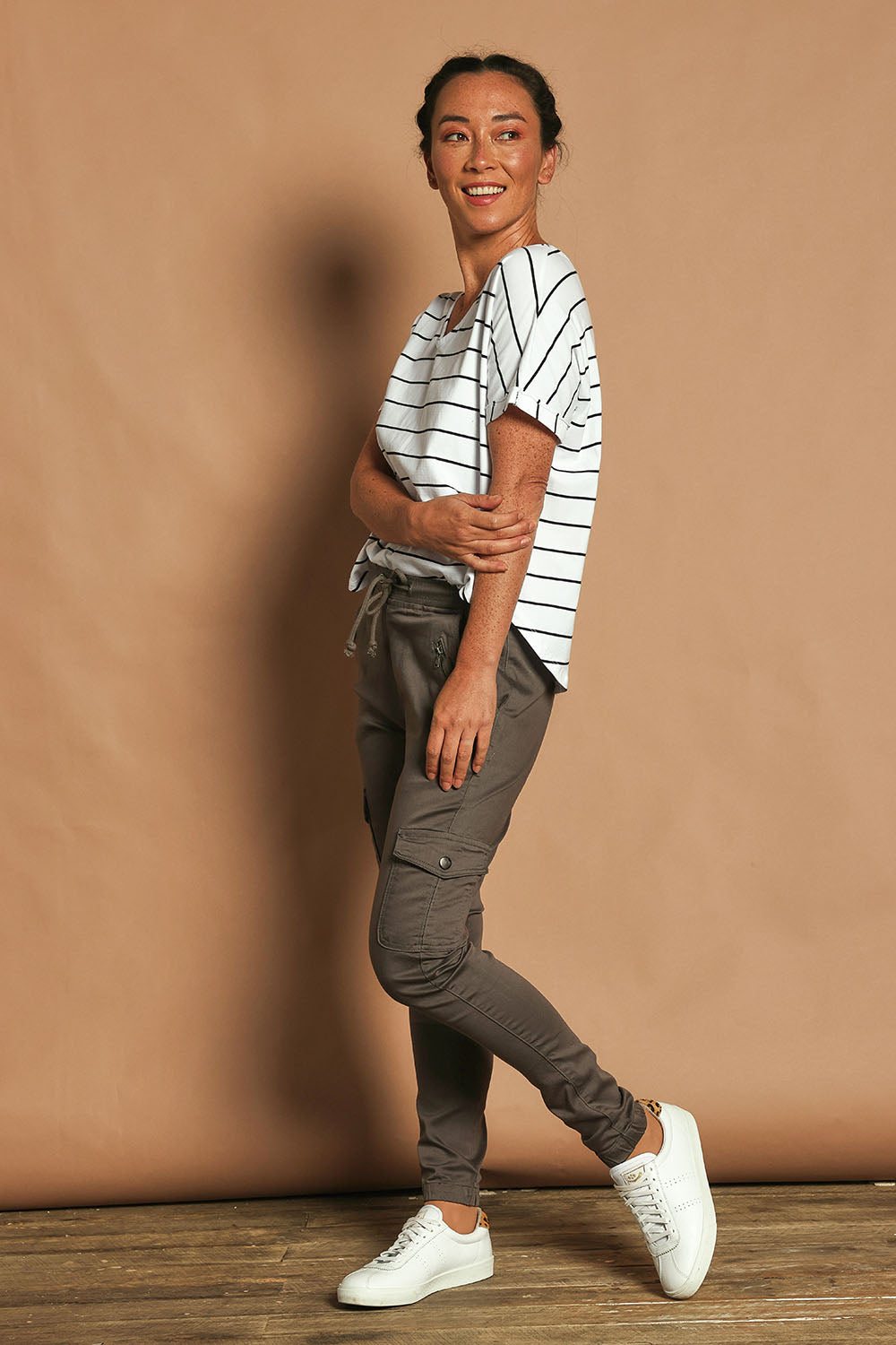 Model Katie wearing size 10 of the Harlow Cargo Jogger in colour Grey (Grey), from the front, showing the whole outfit
