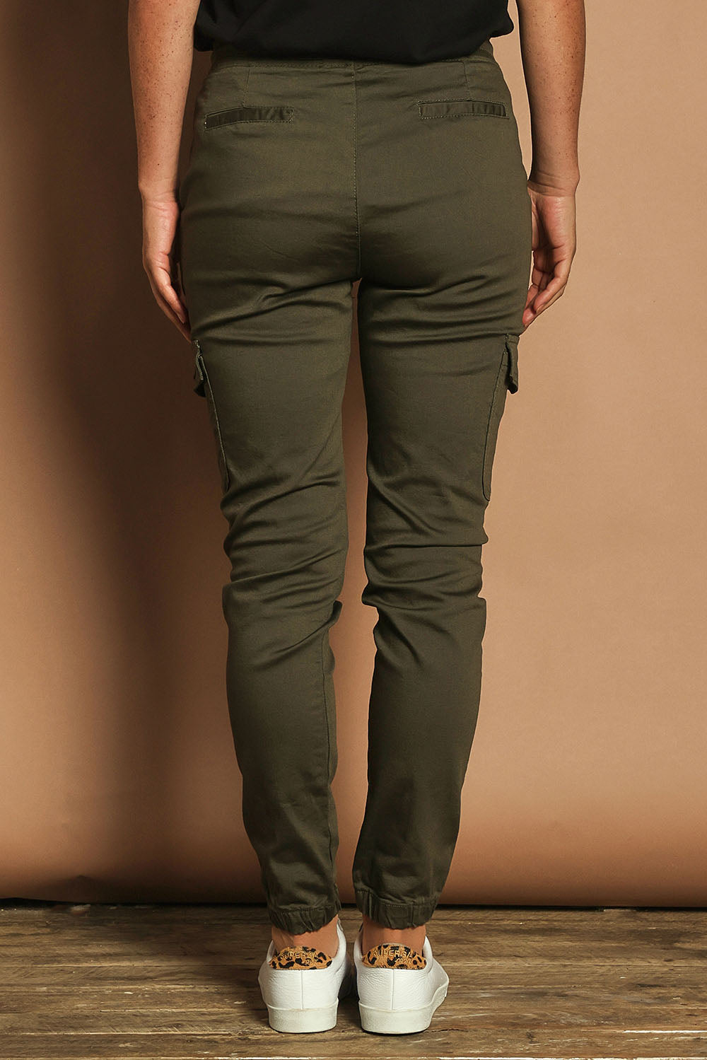 Model Katie wearing size 10 of the Harlow Cargo Jogger in colour Khaki (Green), from the back