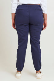Model Chanel wearing size 16 of the Harlow Cargo Jogger in colour Navy (Blue), from the back