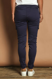 Model Katie wearing size 10 of the Harlow Cargo Jogger in colour Navy (Blue), from the back