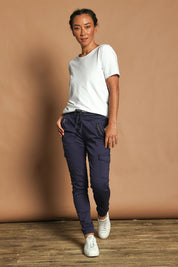 Model Katie wearing size 10 of the Harlow Cargo Jogger in colour Navy (Blue), from the front, showing the whole outfit