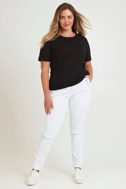 Model Chanel wearing size 16 of the Harlow Cargo Jogger in colour White (White), from the front, showing the whole outfit