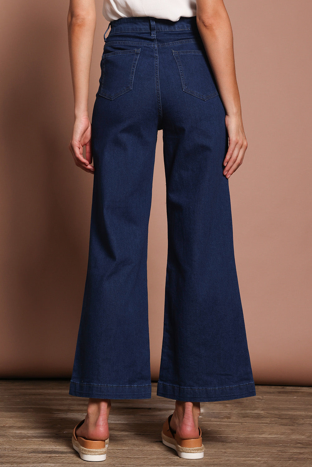 Model Madeline wearing size 9 of the Hayley Highin colourWaisted Wide Leg Jean - Darkdenim (Blue), from the back