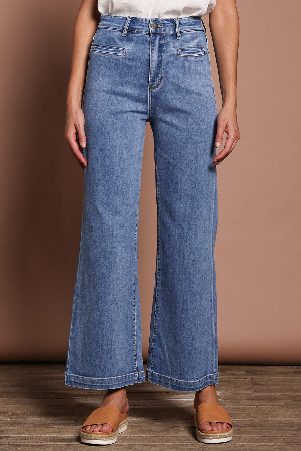 Model Madeline wearing size 9 of the Hayley Highin colourWaisted Wide Leg Jean - Lightdenim (Blue), from the front, cropped image