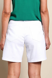 Model Riinar wearing size 10 of the Kate High-Waisted Shorts - White in colour White, from the back