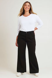 Model Chanel wearing size 16 of the Katie Highin colourWaisted Front Pocket Wide Leg Jean - Black (Black), from the front, showing the whole outfit