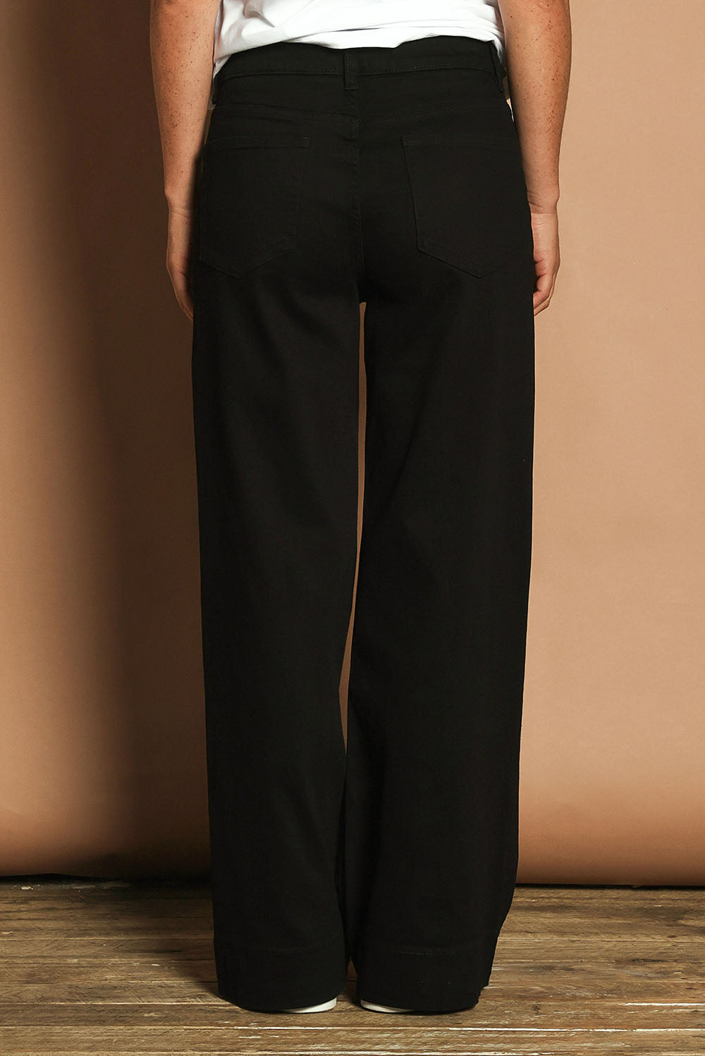 Model Katie wearing size 10 of the Katie Highin colourWaisted Front Pocket Wide Leg Jean - Black (Black), from the back