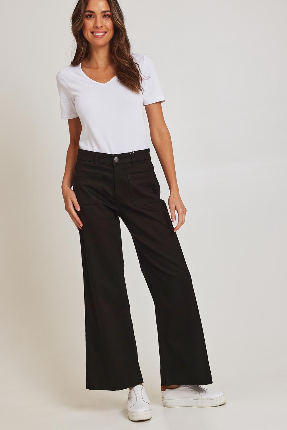 Model Madeline wearing size 10 of the Katie Highin colourWaisted Front Pocket Wide Leg Jean - Black (Black), from the front, showing the whole outfit