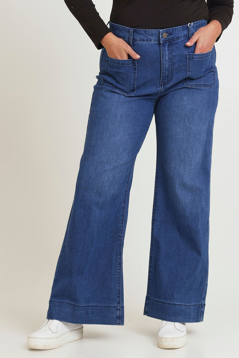 Model Chanel wearing the Katie Highin colourWaisted Front Pocket Wide Leg Jean - Darkdenim (Blue), from the front, cropped image